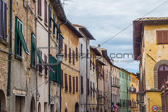 Old houses with blinds in the center of Volterra