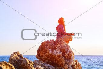young woman in the lotus position