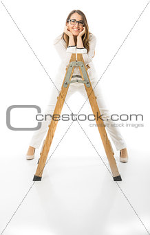 Woman with glasses and wooden ladder