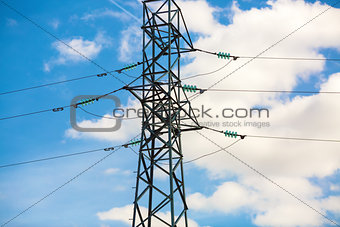 Electricity pylon against blue sky