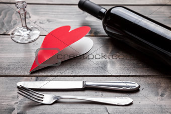 Romantic dinner set on wooden background