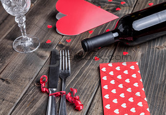 Romantic dinner set on wooden background
