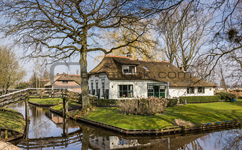 Old white farm in historical village Giethoorn