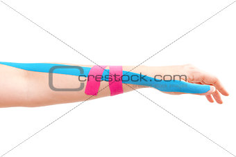 Kinesio tape on female hand.