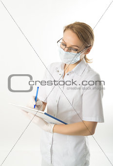 beautiful young female doctor in medical gown and rubber gloves holding a medical records. nurse making entries in medical records