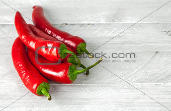 Pepper chili on grey wooden board