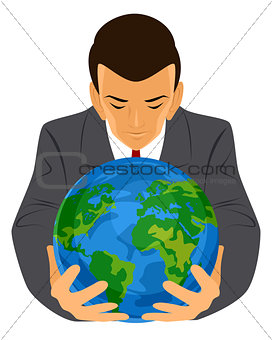 Businessman holding planet