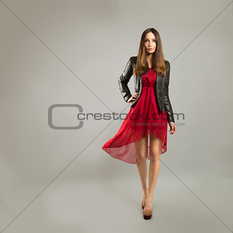 Woman in Red Dress on Gray Background