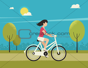 Young woman rides white bicycle