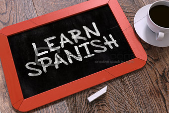 Learn Spanish Concept Hand Drawn on Chalkboard.