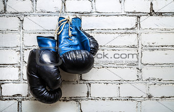 Boxing gloves on brick wall 