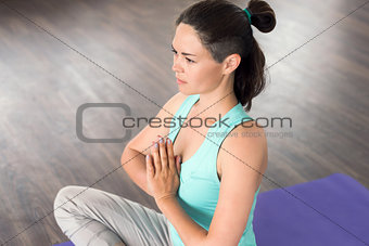 young girl engaged in yoga and meditation. Namaste