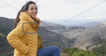 Smiling woman appreciating the peace of nature