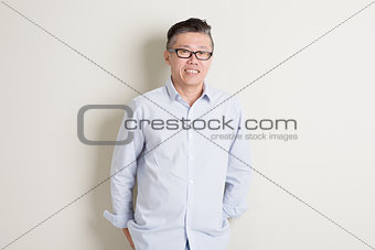 Portrait of mature Asian man