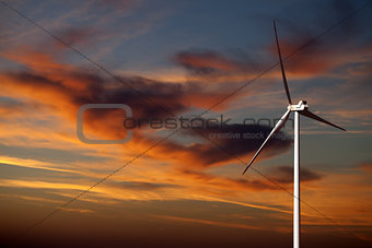 Wind turbine and sunset sky 