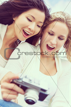 Two Young Women Girls Using Digital Camera