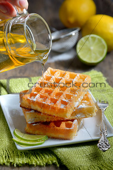 stack of waffles with honey
