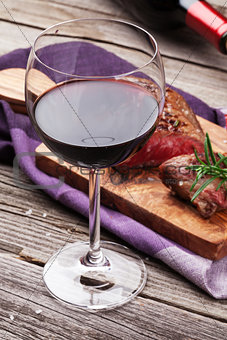 Red wine glass and grilled beef steak