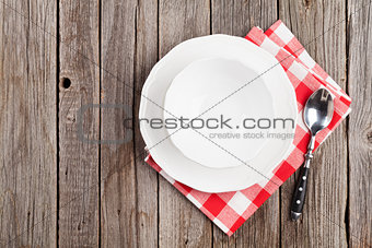 Empty plate, bowl and spoon