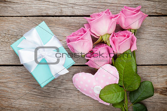 Gift box, pink roses bouquet and heart toy