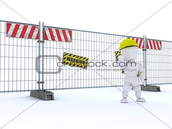 man with construction barrier fence