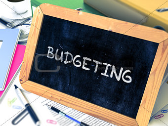Budgeting Concept Hand Drawn on Chalkboard.