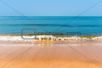 yellow sand and beautiful sea waves