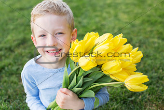 kid holding flowers