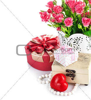 Red heart wooden casket with bunch roses