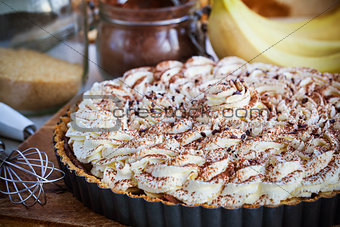 Banoffee pie with whipped cream and chocolate