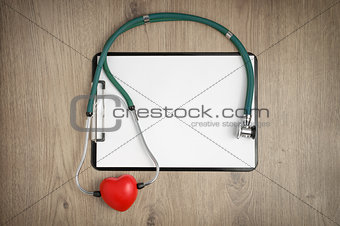 Clipboard with stethoscope and heart shape