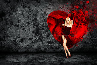 Woman with Splashing Heart on Dark Background