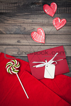 Romantic red envelope on a wooden background Valentine's Day heart-shaped invitation