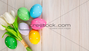 Easter eggs with bunch of tulip flowers