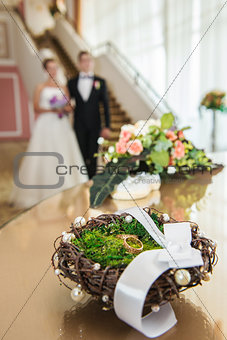 Wedding rings in a decorative nest