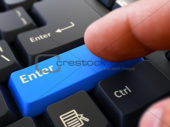 Finger Presses Blue Keyboard Button Enter.