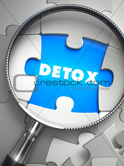 Detox - Puzzle with Missing Piece through Loupe.