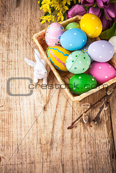 Easter still life with basket eggs rabbit