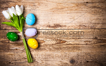 Easter eggs with bunch tulips copyspace