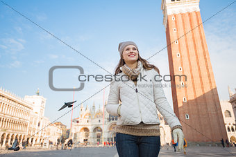 Portrait of happy young woman on Piazza San Marco, Venice