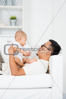 Father playing with baby 
