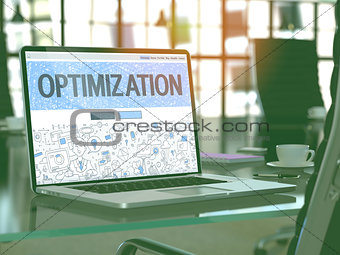 Optimization on Laptop in Modern Workplace Background.
