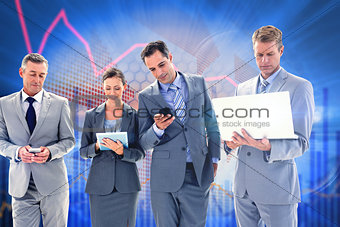 Composite image of business colleagues using their multimedia devices
