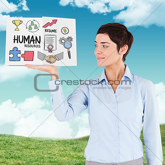 Composite image of businesswoman showing a book