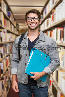 Composite image of student smiling at camera in library