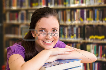 Composite image of portrait of female student in library