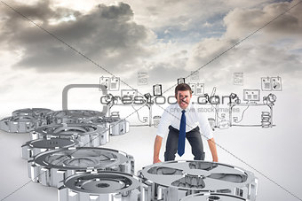Composite image of businessman bending and lifting