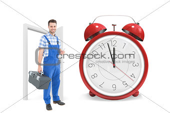 Composite image of male repairman carrying toolbox