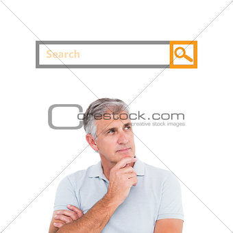 Composite image of casual man thinking with hand on chin