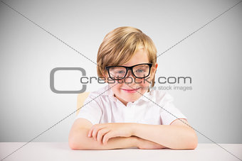 Composite image of cute pupil smiling at camera